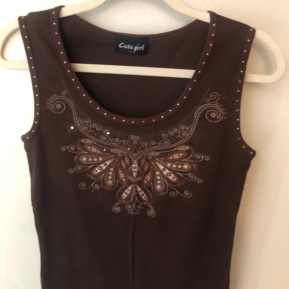 Cute girl sleeveless brown tank style top.